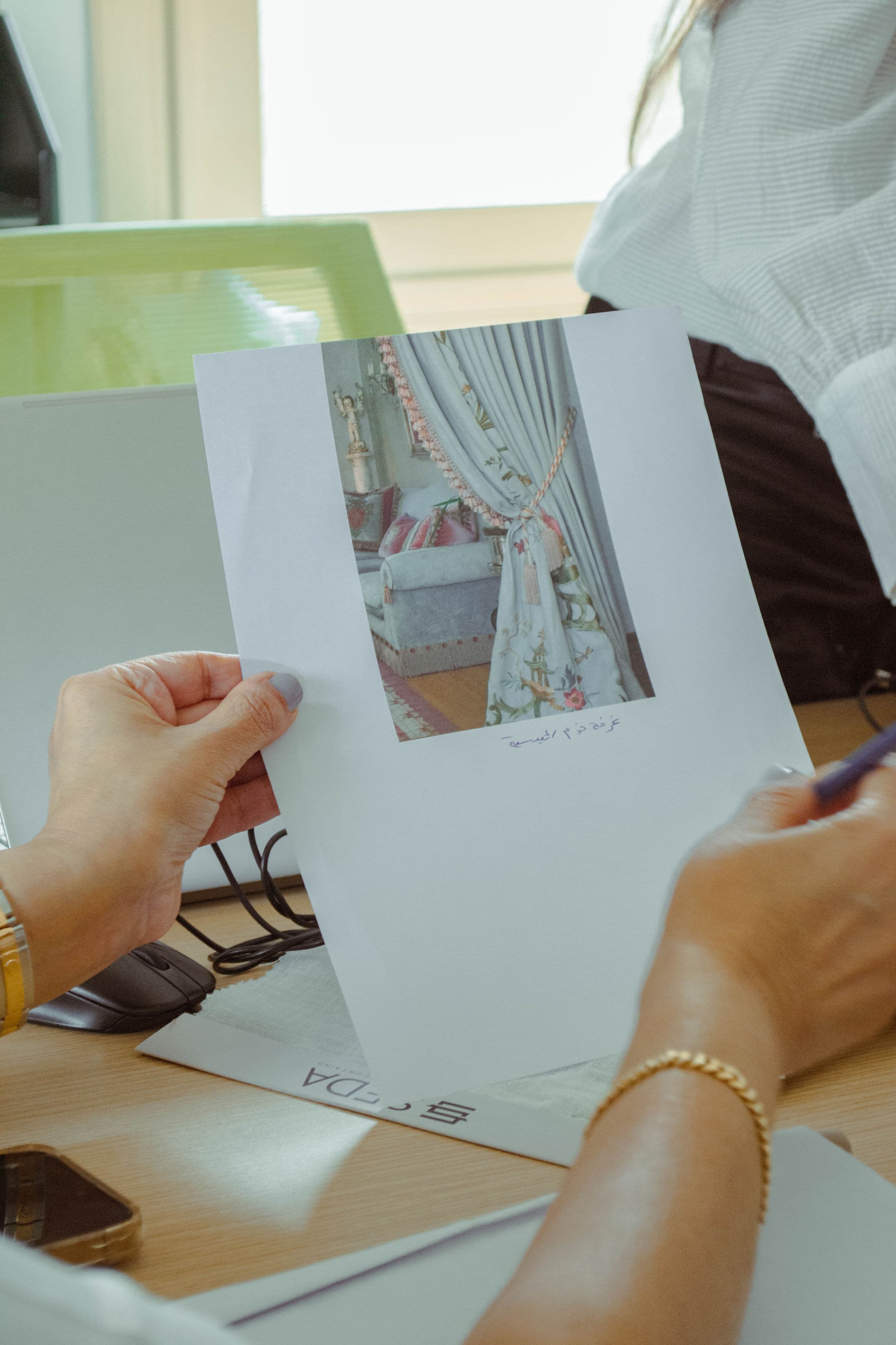 Reviewing curtain fabric swatches and mood shots